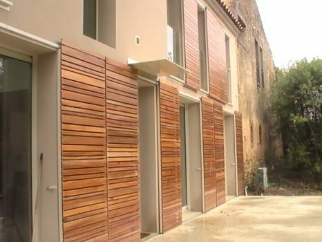 Fabricant de volets coulissants en bois exotique architecte Henri Gueydan