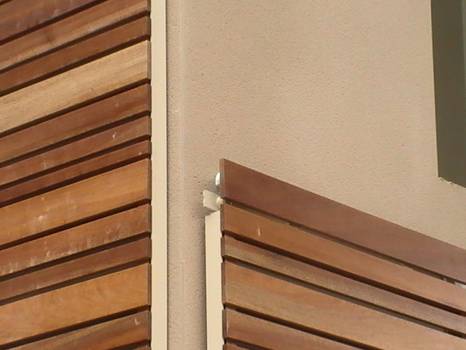 Fabricant de volets coulissants en bois exotique architecte Henri Gueydan