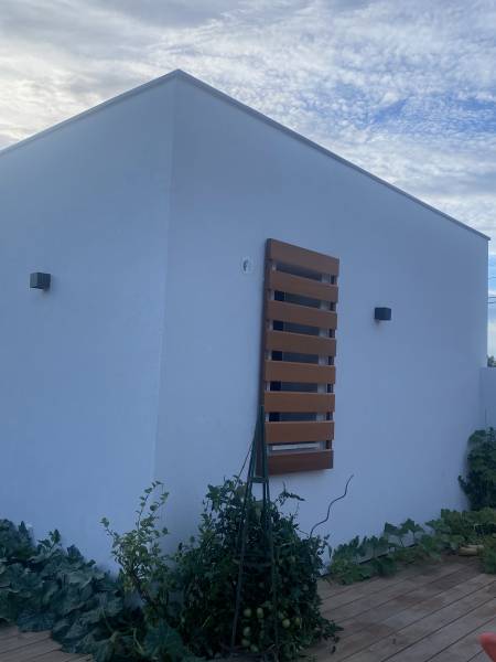 Réalisation de volets coulissants en bois sur mesure